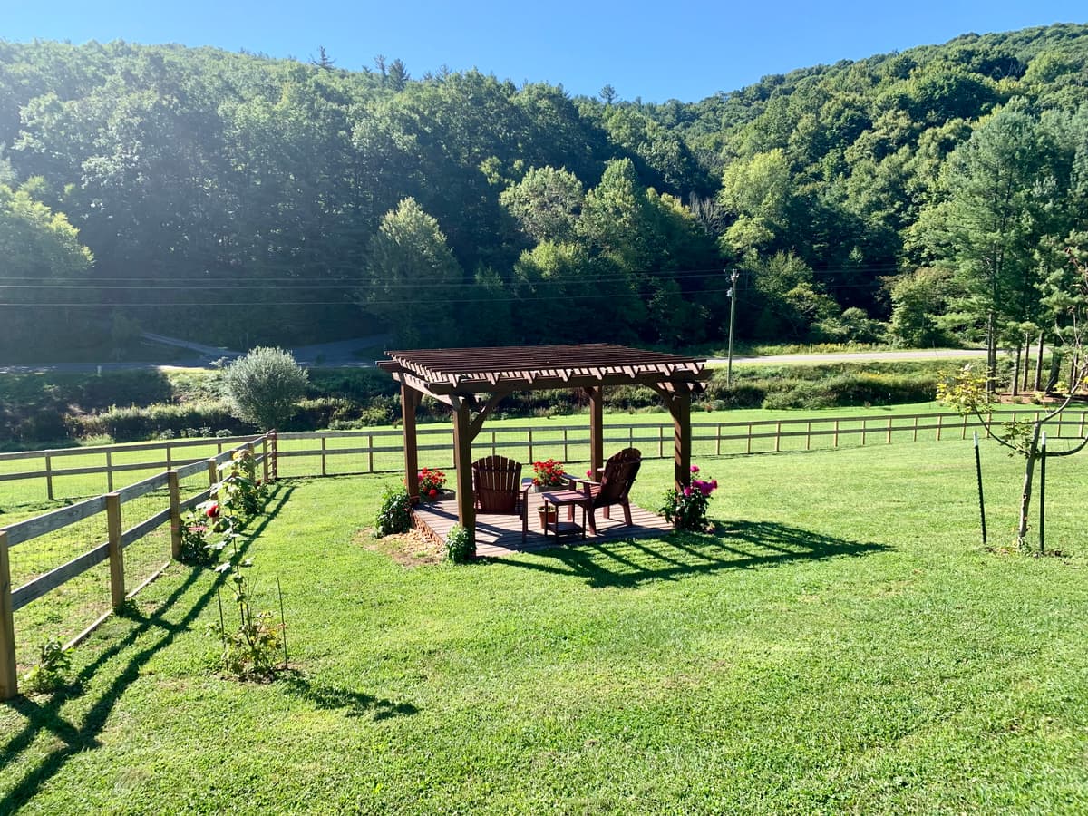 Pergola seating area with mountain backdrop